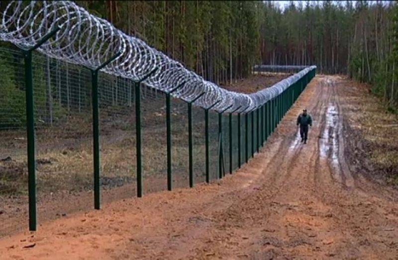 Latvia fenced off from Russia by a fence with barbed wire