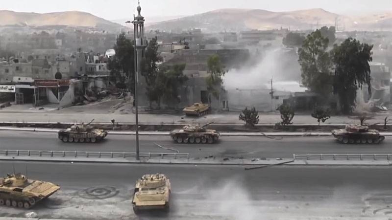 CAA is shown fighting with insurgents in Hama province: MRL and tanks in action