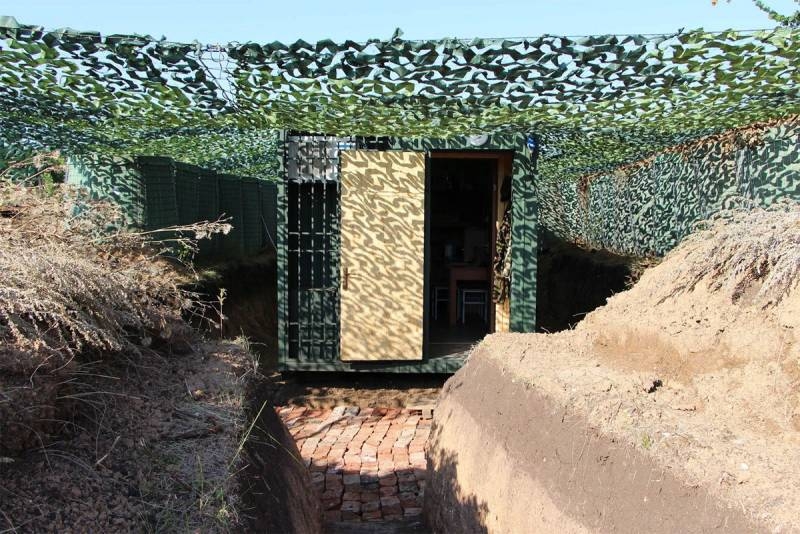 Modular shelters provided for the APU with plastic windows, facing a blank wall