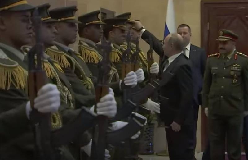 In Palestine, Putin discuss action, who has put his cap on his head guards